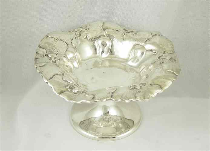 Appraisal: AMERICAN STERLING SILVER COMPOTE floral design with ruffled rim Dimensions