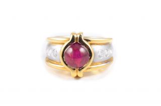 Appraisal: A Two With a center ruby weighing carat flanked by