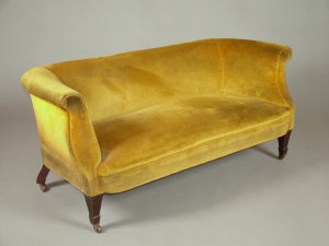 Appraisal: A mustard upholstered two seater sofa late th century the