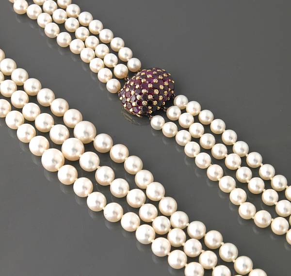 Appraisal: A triple strand of graduated cultured pearls with ruby and