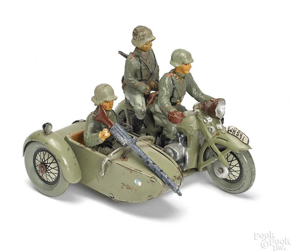 Appraisal: Painted tin clockwork military motorcycle etc Painted and lithographed tin