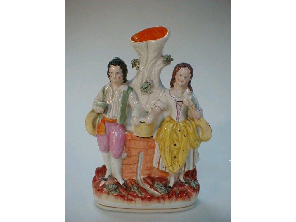 Appraisal: A Victorian Staffordshire figure group with spill vase tree trunk