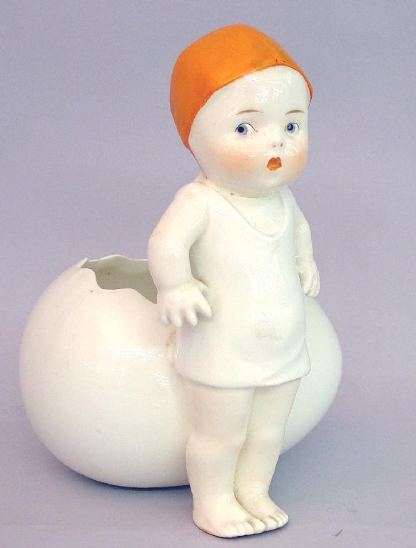 Appraisal: Continental porcelain Kewpie figural vase model standing in front of