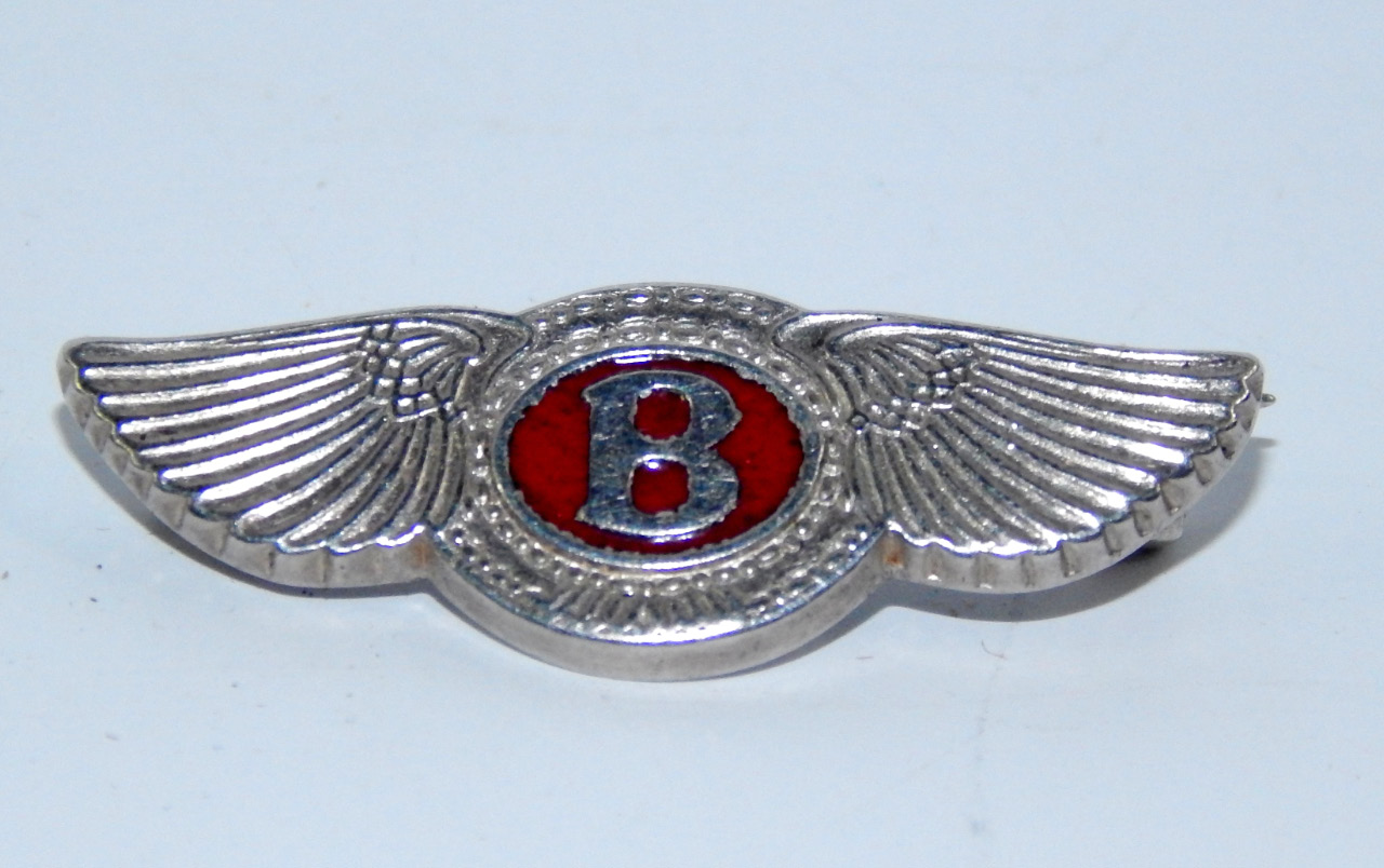 Appraisal: A silver Bentley pin badge in the form of Bentley