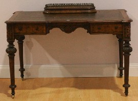 Appraisal: A Victorian walnut writing table made by Druce and Co