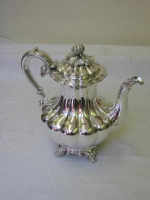 Appraisal: A WILLIAM IV COFFEE POT of lobed baluster form the