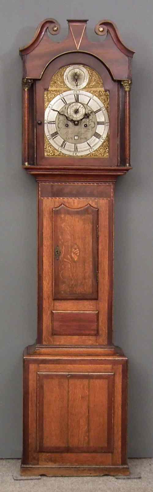 Appraisal: An early th Century oak and mahogany cased longcase clock