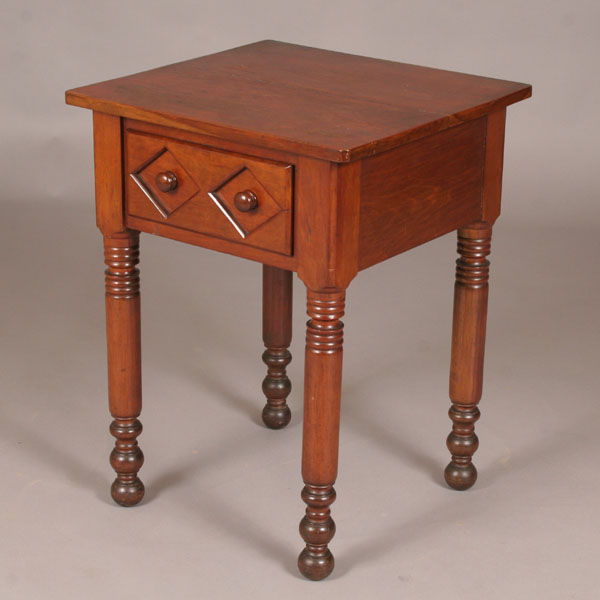 Appraisal: Primitive stand table turned legs single drawer carved diamond design