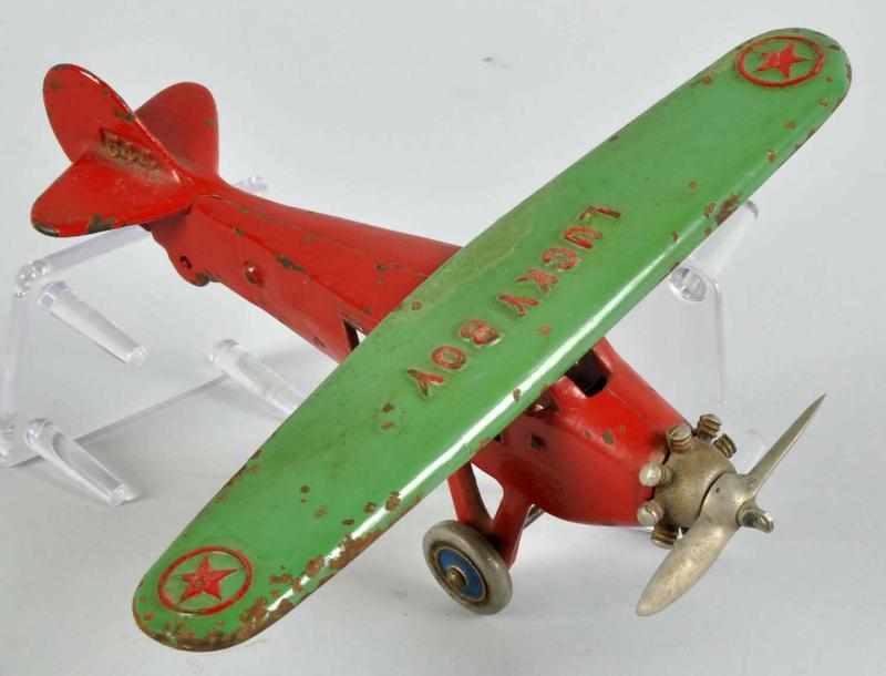 Appraisal: Cast Iron Dent Lucky Boy Airplane Toy Description American Unusual