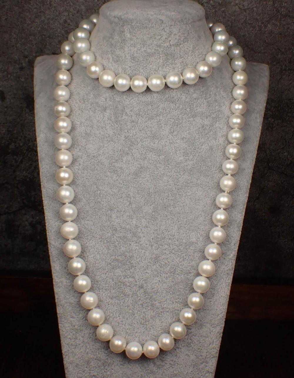 Appraisal: OPERA LENGTH WHITE PEARL NECKLACE The hand-knotted strand with well