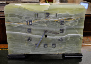 Appraisal: An Art Deco onyx mantel clock with applied chrome numerals