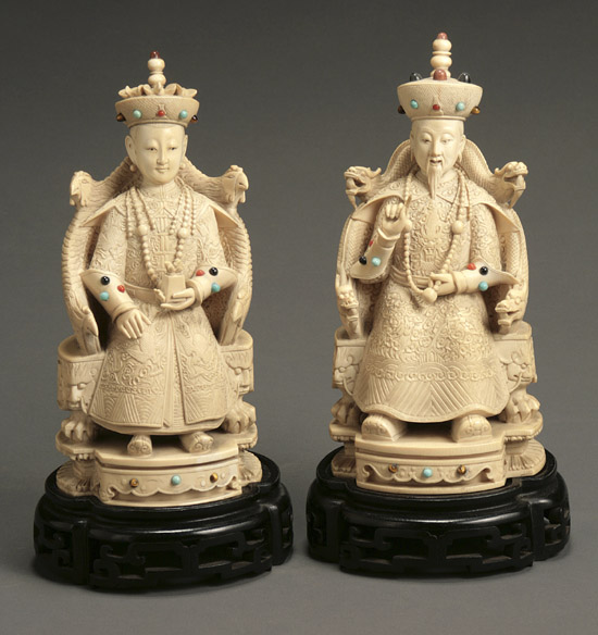 Appraisal: Pair of Chinese Jeweled Ivory Figures of an Enthroned Official