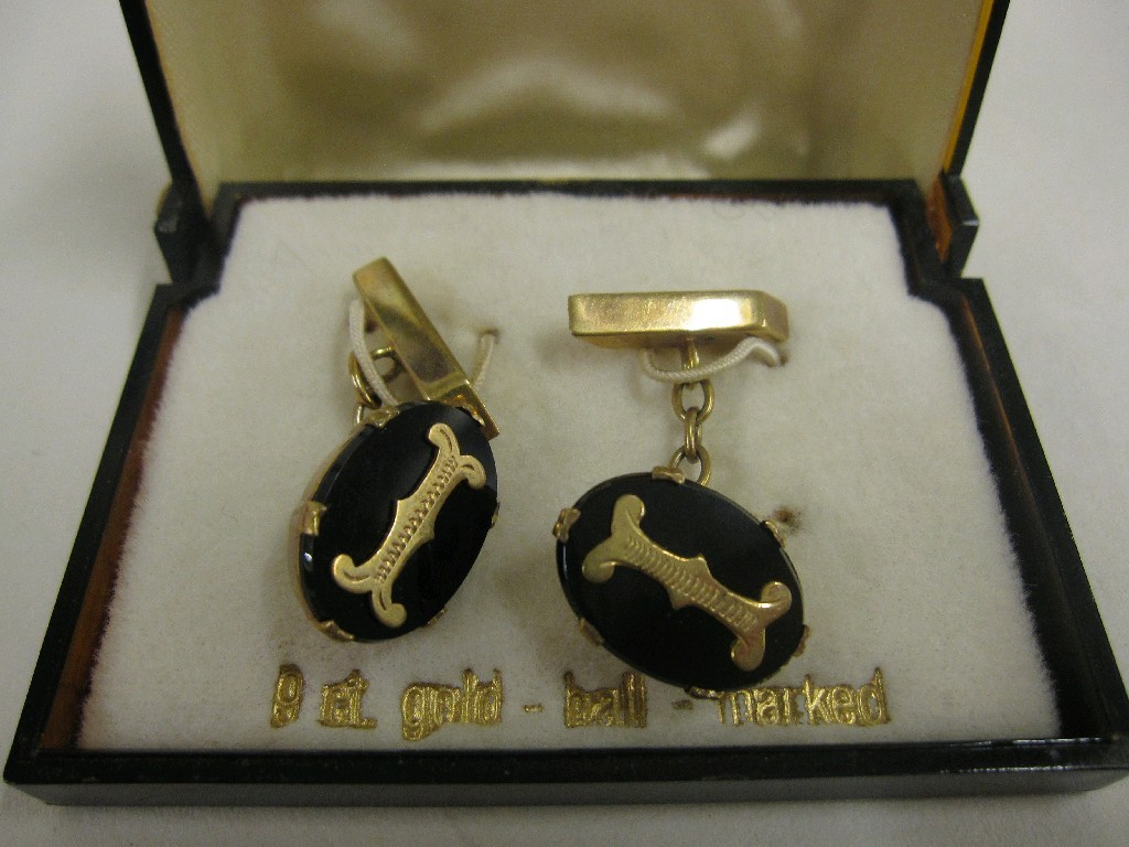 Appraisal: Nine carat gold and onyx initial cuff links