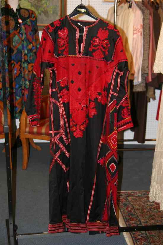 Appraisal: PALESTINIAN EMBROIDERED THOB early s Black ground with extensive red