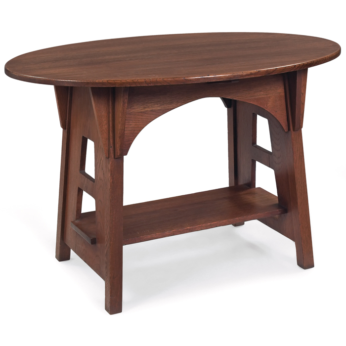 Appraisal: Limbert table oval top over splayed sides with cut-outs supporting