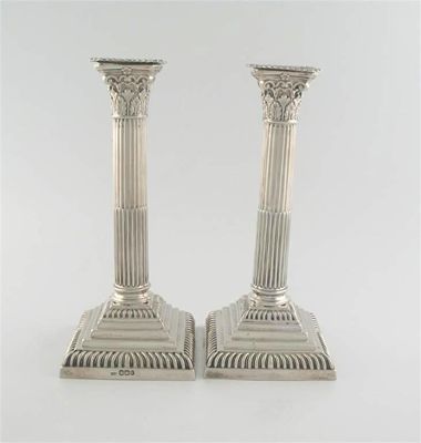 Appraisal: A pair of Victorian Corinthian column candlesticks with gadrooned borders