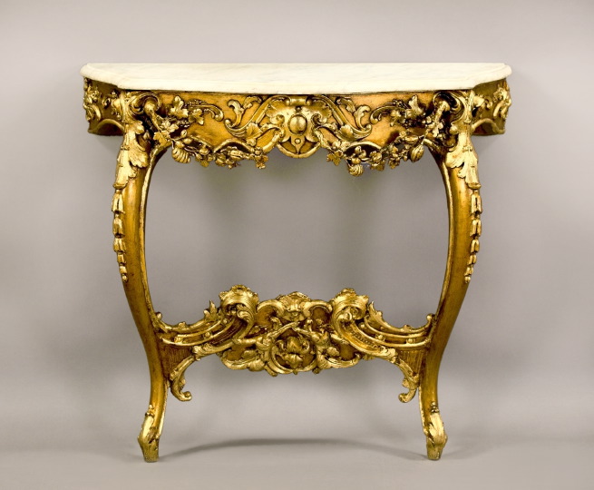 Appraisal: Louis XV-Style Giltwood and Marble-Top Console the molded serpentine marble