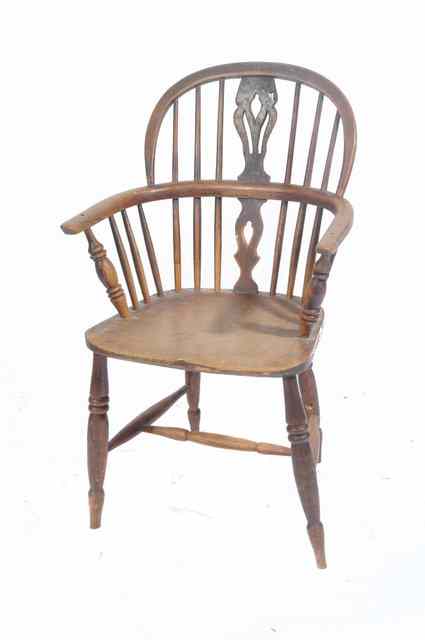 Appraisal: AN OLD ASH AND ELM WINDSOR ARMCHAIR with pierced splat