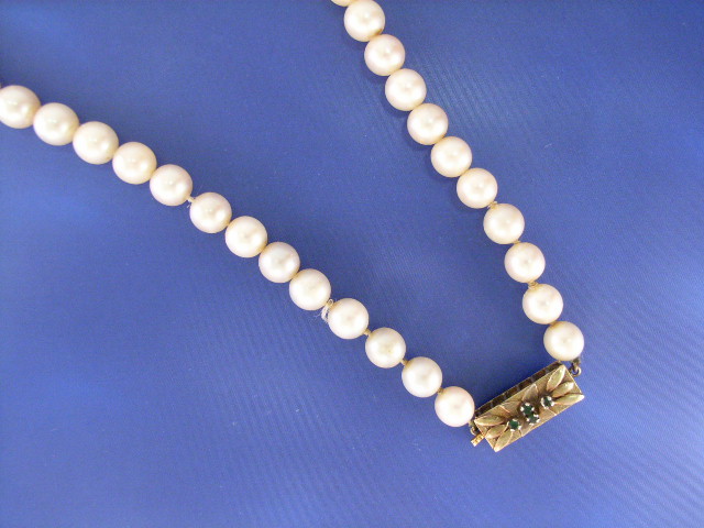 Appraisal: A - mm cultured pearl necklace with a ct gold