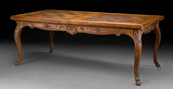 Appraisal: A Louis XV Provincial carved walnut draw leaf table The