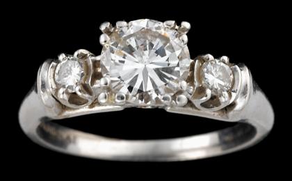 Appraisal: Platinum and diamond ringRound brilliant diamond approximately carat flanked by