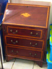 Appraisal: An Edwardian satinwood crossbanded mahogany bureau of compact inch width