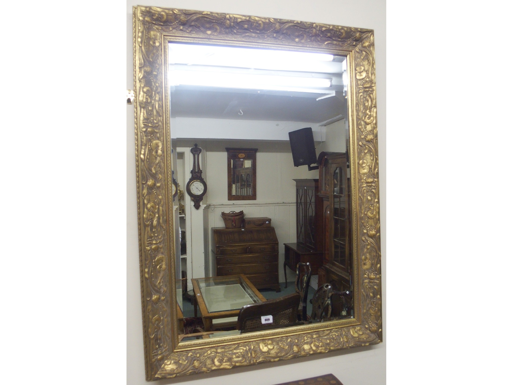 Appraisal: A modern gilt bevelled glass mirror x cm