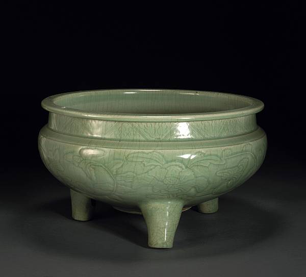 Appraisal: A Zhejiang celadon tripod censer th Century Carved beneath the