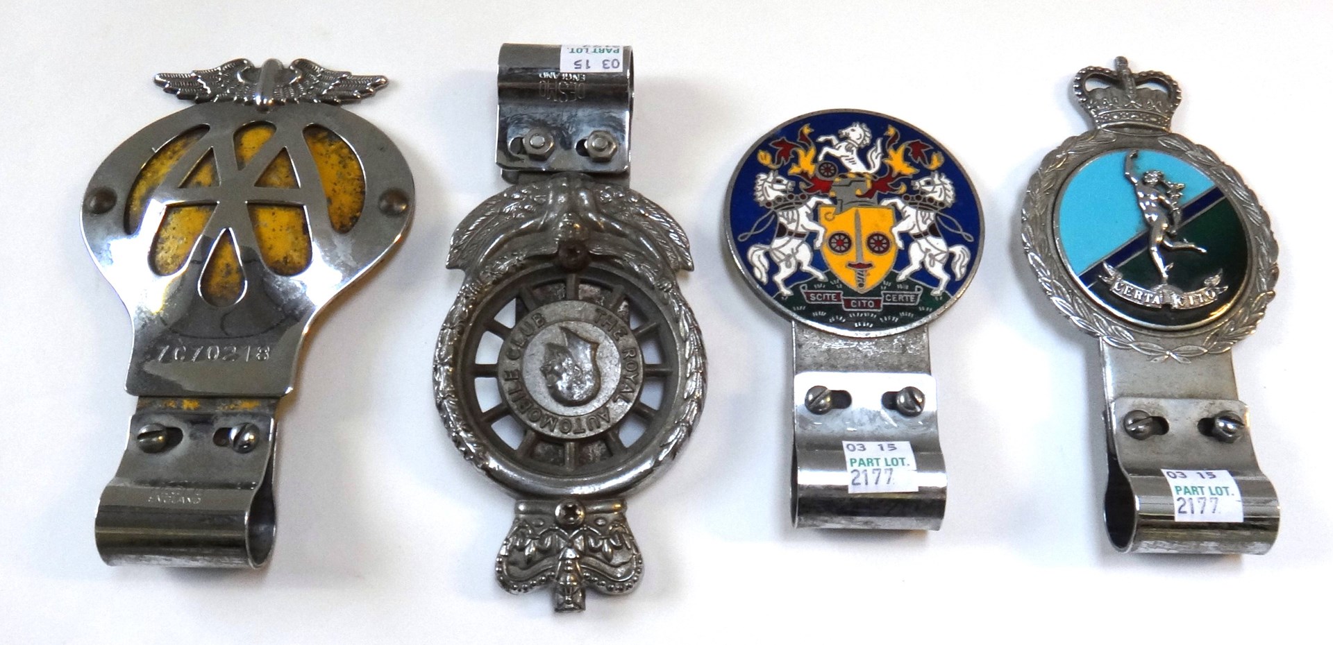 Appraisal: Four vintage car badges comprising a yellow and chrome AA