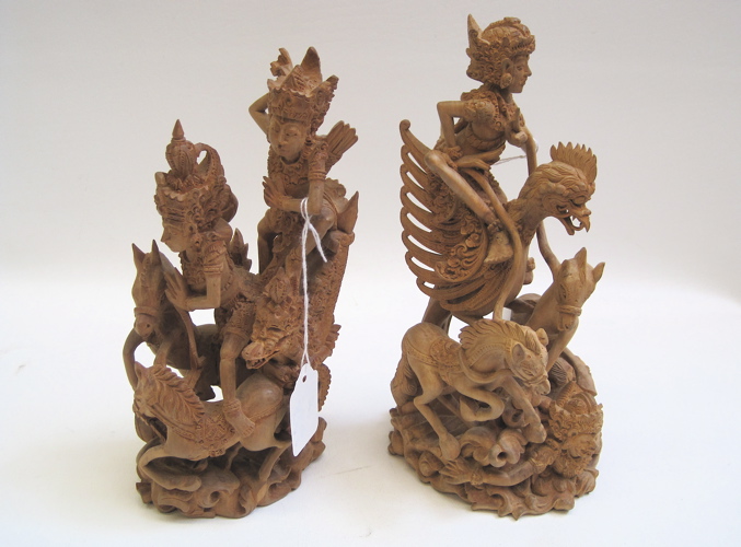 Appraisal: PAIR BALINESE HAND CARVED WOOD FIGURES stylized phoenix bird with