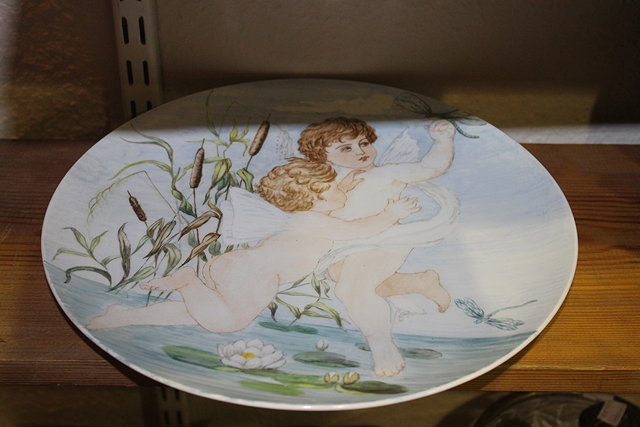 Appraisal: A BERLIN PORCELAIN WALL PLATE painted with two cherubs bull