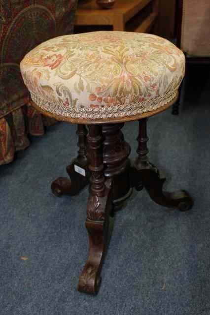 Appraisal: A VICTORIAN PIANO STOOL with turned and carved support and