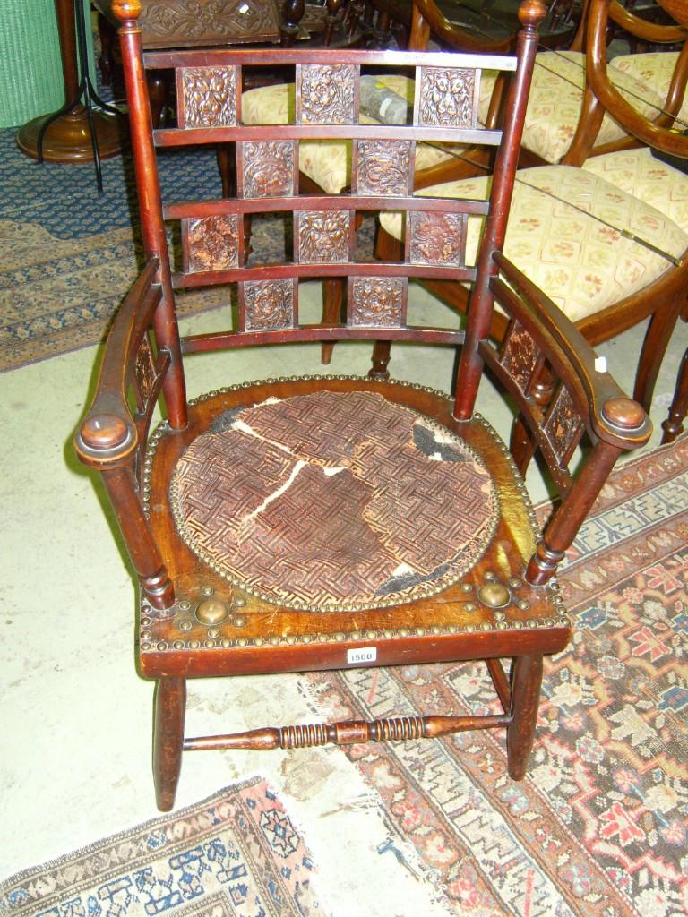 Appraisal: A late th century elbow chair with embossed leather panels