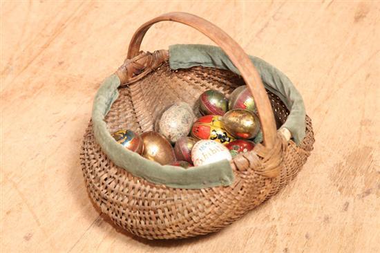 Appraisal: GROUP OF EGGS AND BASKET Nineteen eggs eighteen are tin