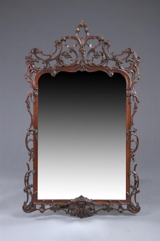 Appraisal: ROCOCO STYLE HANGING WALL MIRROR early th century mahogany With