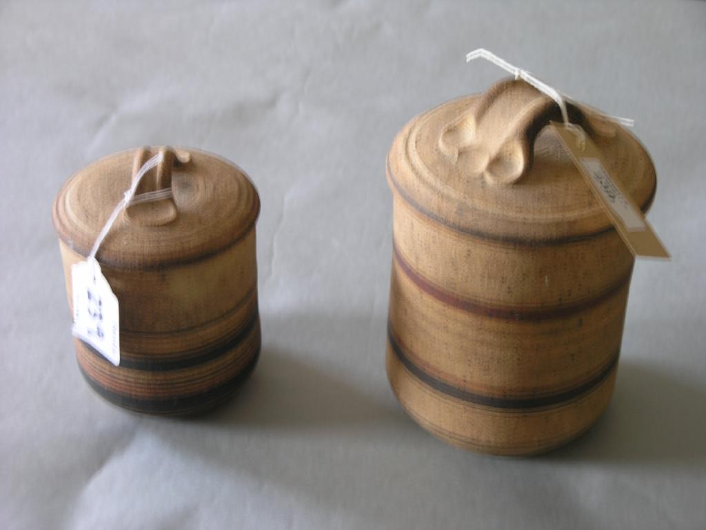 Appraisal: Two Welsh studio pottery storage jars each painted with a