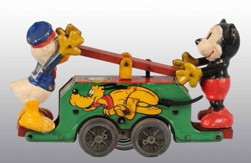 Appraisal: Walt Disney Mickey Mouse Donald Duck Handcar Toy Description England