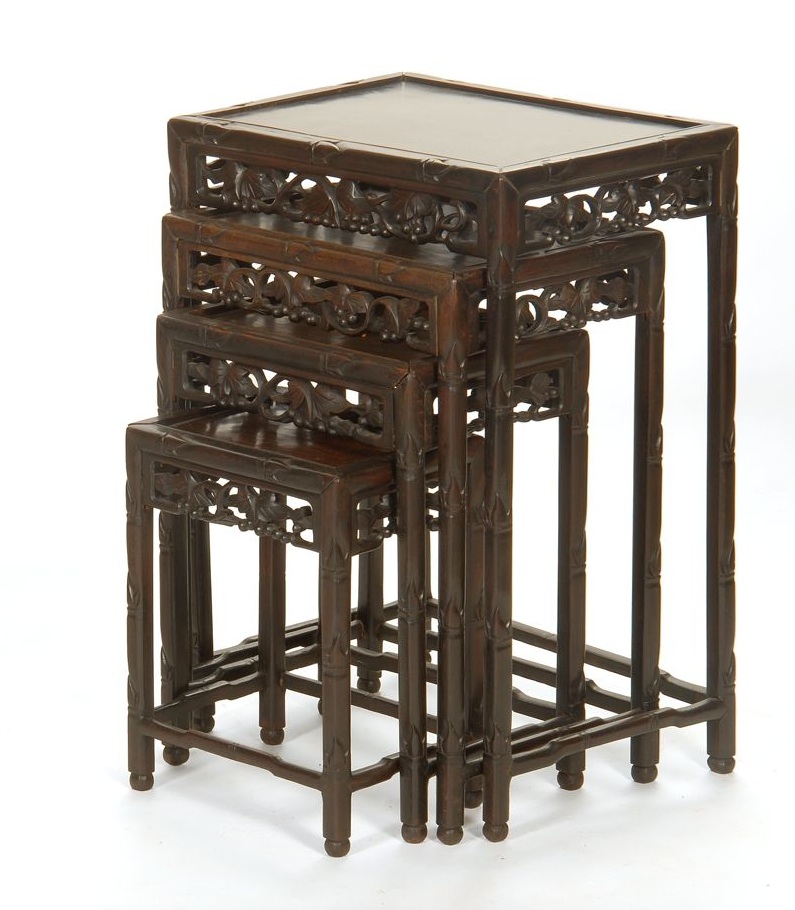 Appraisal: NEST OF FOUR CHINESE CARVED WOOD TABLES Second Half of