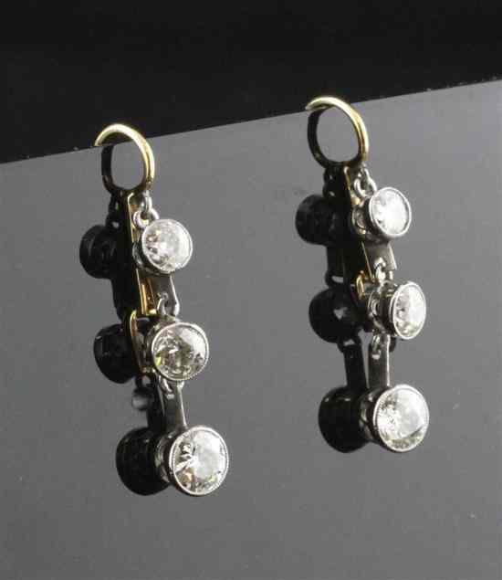 Appraisal: A pair of Edwardian white and yellow gold diamond drop