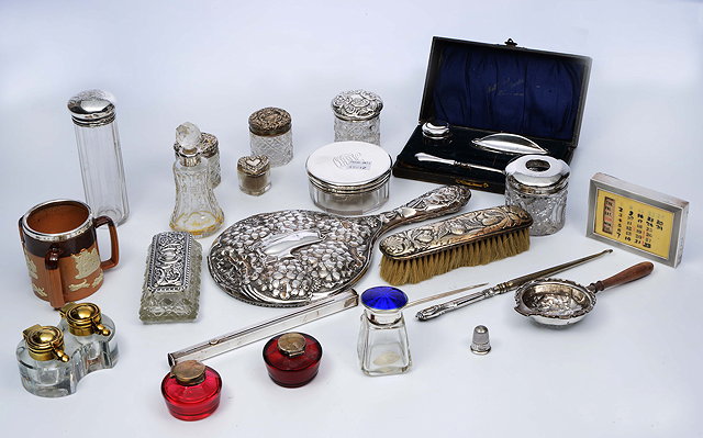 Appraisal: A COLLECTION OF VICTORIAN AND LATER SILVER TOPPED GLASS BOTTLES