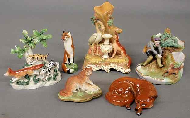 Appraisal: Porcelain figural group of a fox being chased by two