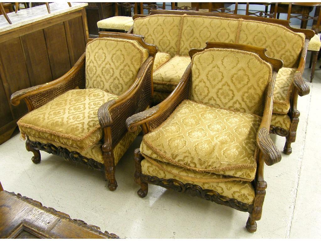 Appraisal: Early th century bergere double caned three piece walnut lounge