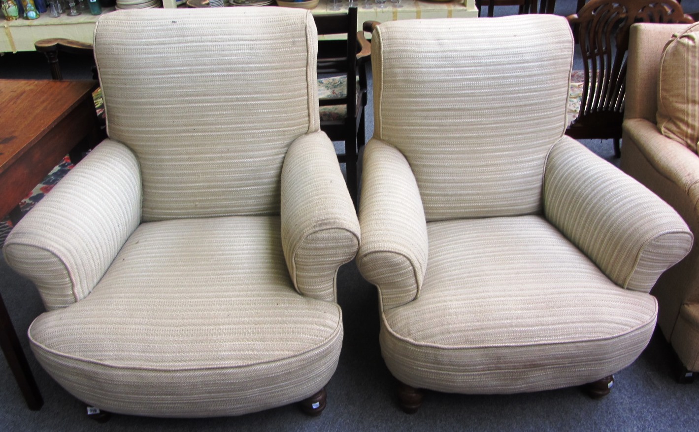 Appraisal: A pair of easy armchairs with bow seats on turned