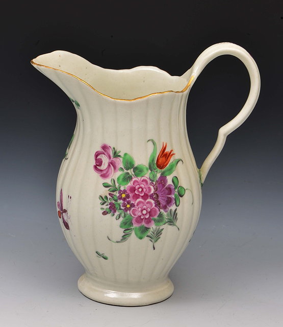 Appraisal: Worcester milk jugcirca with ribbed body decorated in polychrome enamels