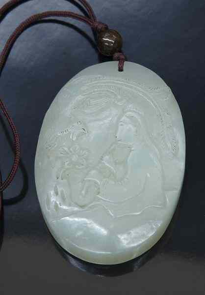 Appraisal: Chinese Qing carved jade pendantdepicting a lady playing the lute