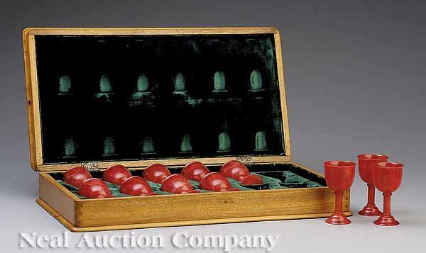 Appraisal: A Set of Twelve Red Carved Stone Stemmed Cordials th