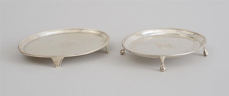 Appraisal: TWO GEORGE III SILVER TEAPOT STANDS One Hester Bateman London