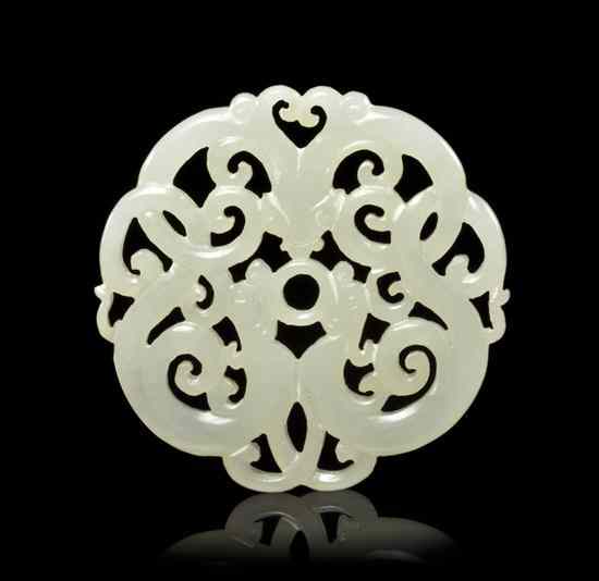 Appraisal: A Chinese White Jade Circular Plaque pierce carved depicting three