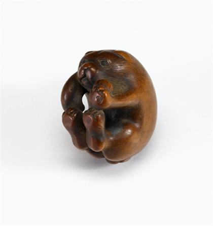 Appraisal: Fine Japanese boxwood okimono of a pup with ball edo