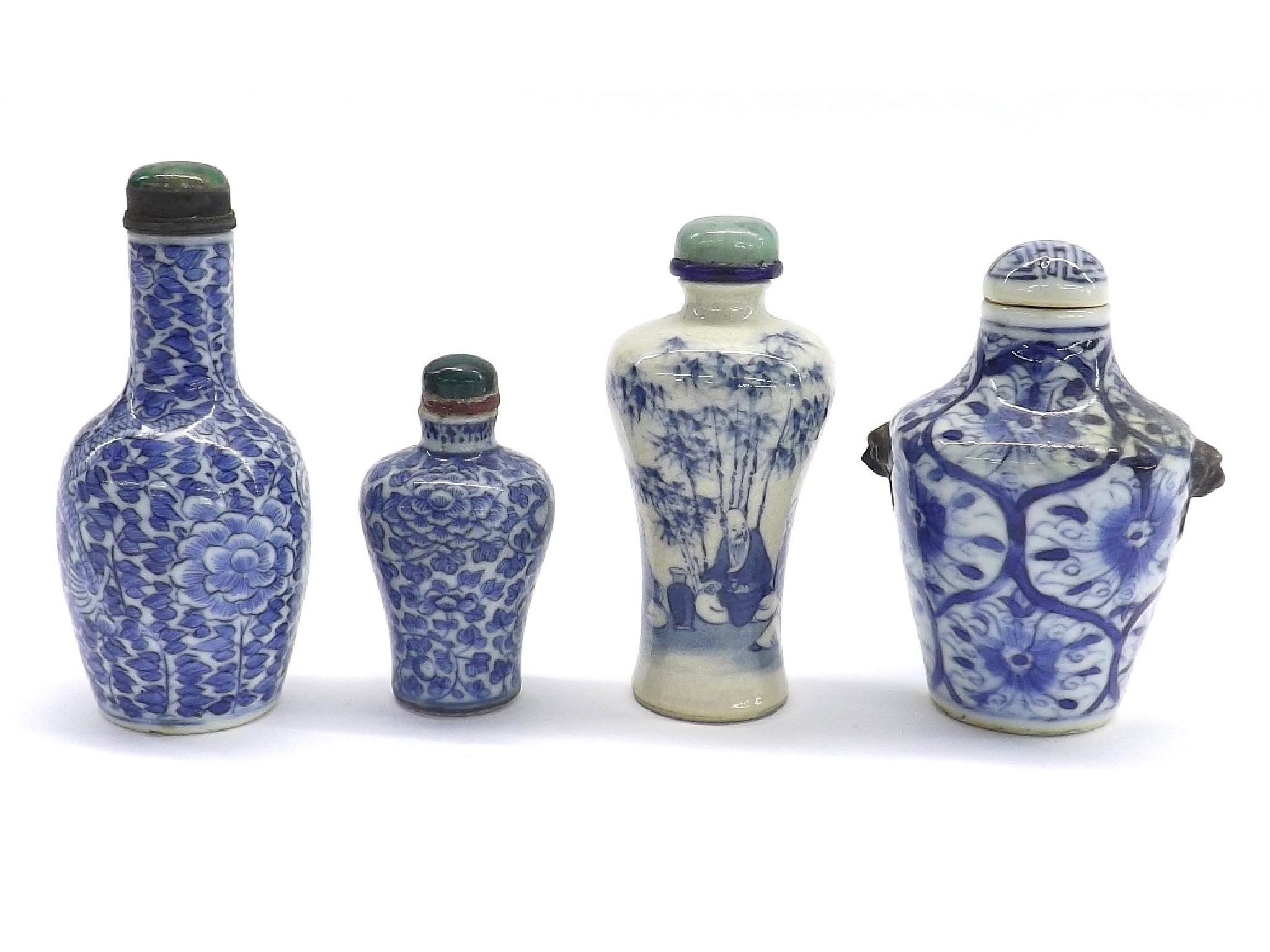 Appraisal: Four baluster blue and white snuff bottles